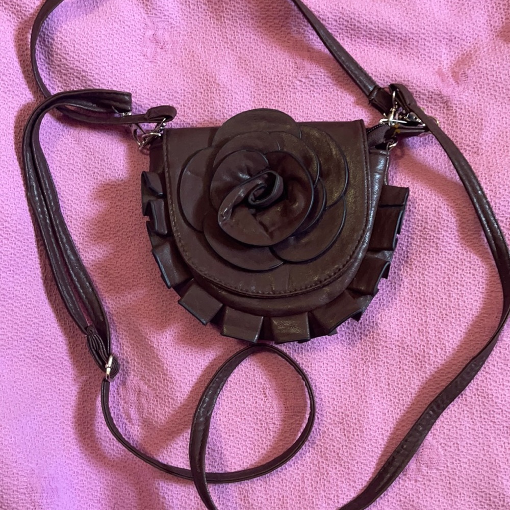 Cute little brown leather feel rose clutch NWOT